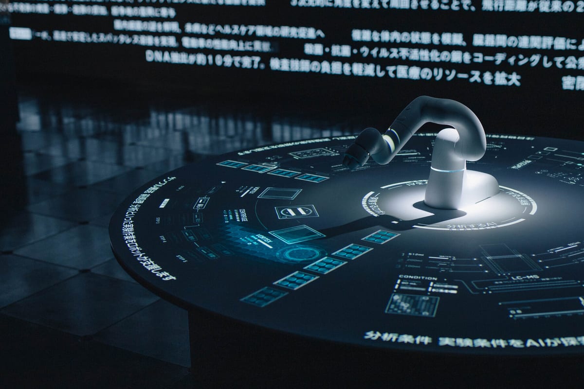 Robotic arm synchronized with projected motion graphics in the EFFECT exhibition