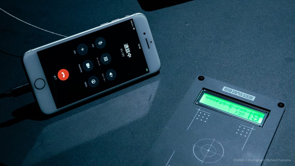 Smartphone and custom card reader used to play recorded messages in the 050-5893-5336 exhibition