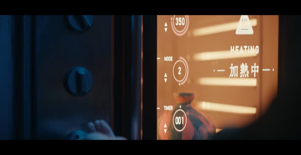 Screen UI displayed on the glass surface of a ceramic kiln in Previously Saved Version